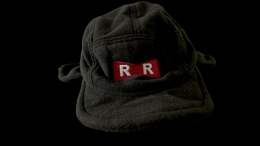 Front view of the Red Ribbon trapper hat, black fleece anime hat with red RR embroidered patch